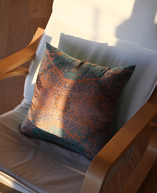 Printed cushion in a sunlit room